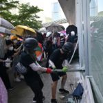 Hong Kong protesters storm government HQ as police officers injured by hurled ‘liquid’