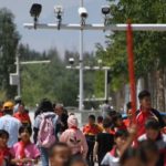 China Snares Tourists’ Phones in Surveillance Dragnet by Adding Secret App
