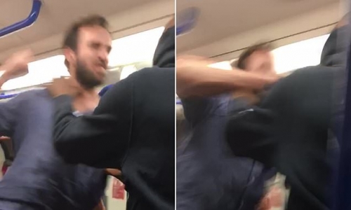 Terrifying moment Tube thug launches punch at shocked passenger