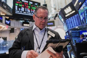 Crude oil prices fall again, while US stocks drift near their all-time highs