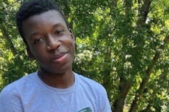 White homeowner accused of shooting a Black teen who rang his doorbell turns himself in to face criminal charges