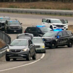 Maine authorities detained a person of interest after 4 people were found dead in a home and 3 others shot while driving