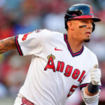 Angels third baseman brings basketball onto the diamond, turns slick double play with unconventional move