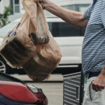 Inflation cooled last month as gas prices fell, though costs remain elevated