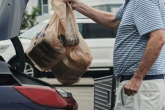 Inflation cooled last month as gas prices fell, though costs remain elevated