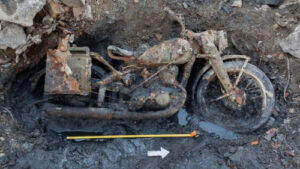 WWII motorcycle and soldiers emerge from river muck in Hungary