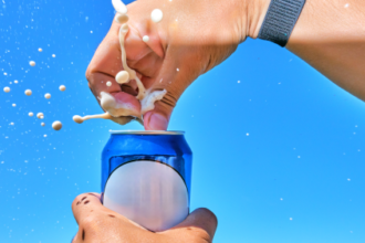 Does tapping on a soda can really stop it from exploding?