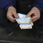Iran’s rial currency hits new record low of more than 2 million to the dollar