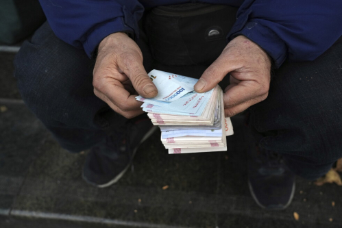 Iran’s rial currency hits new record low of more than 2 million to the dollar