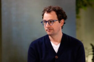 Anthropic’s new research maps three wildly different futures for the AI economy—and the future of knowledge work